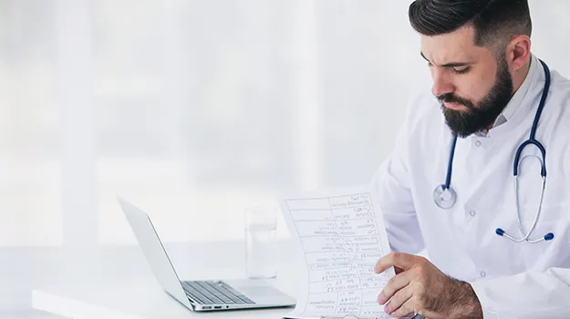 doctor working with documents and medical forms
